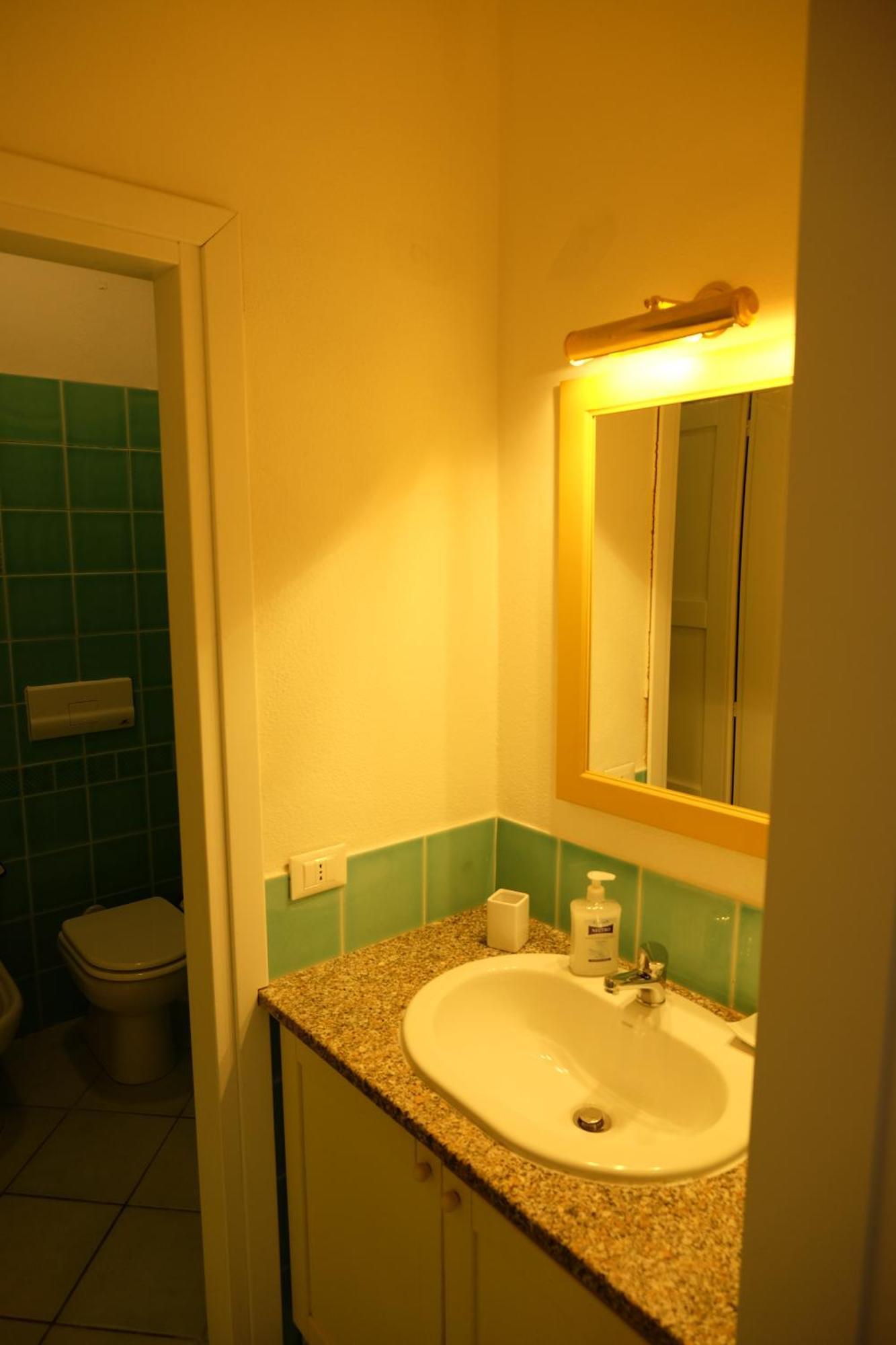 Calarossa Sardinia Apartments Isola Rossa Bagian luar foto