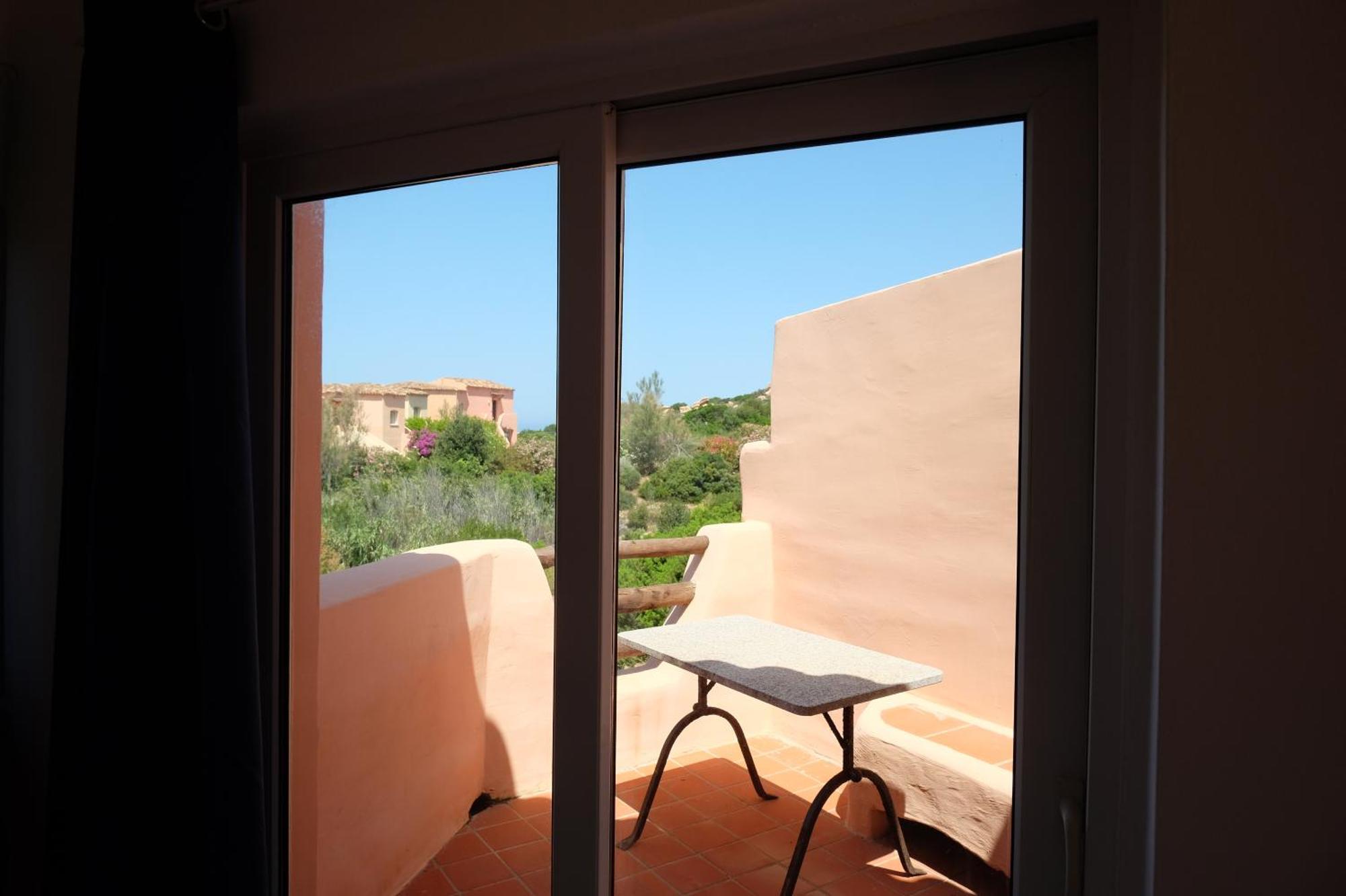 Calarossa Sardinia Apartments Isola Rossa Bagian luar foto
